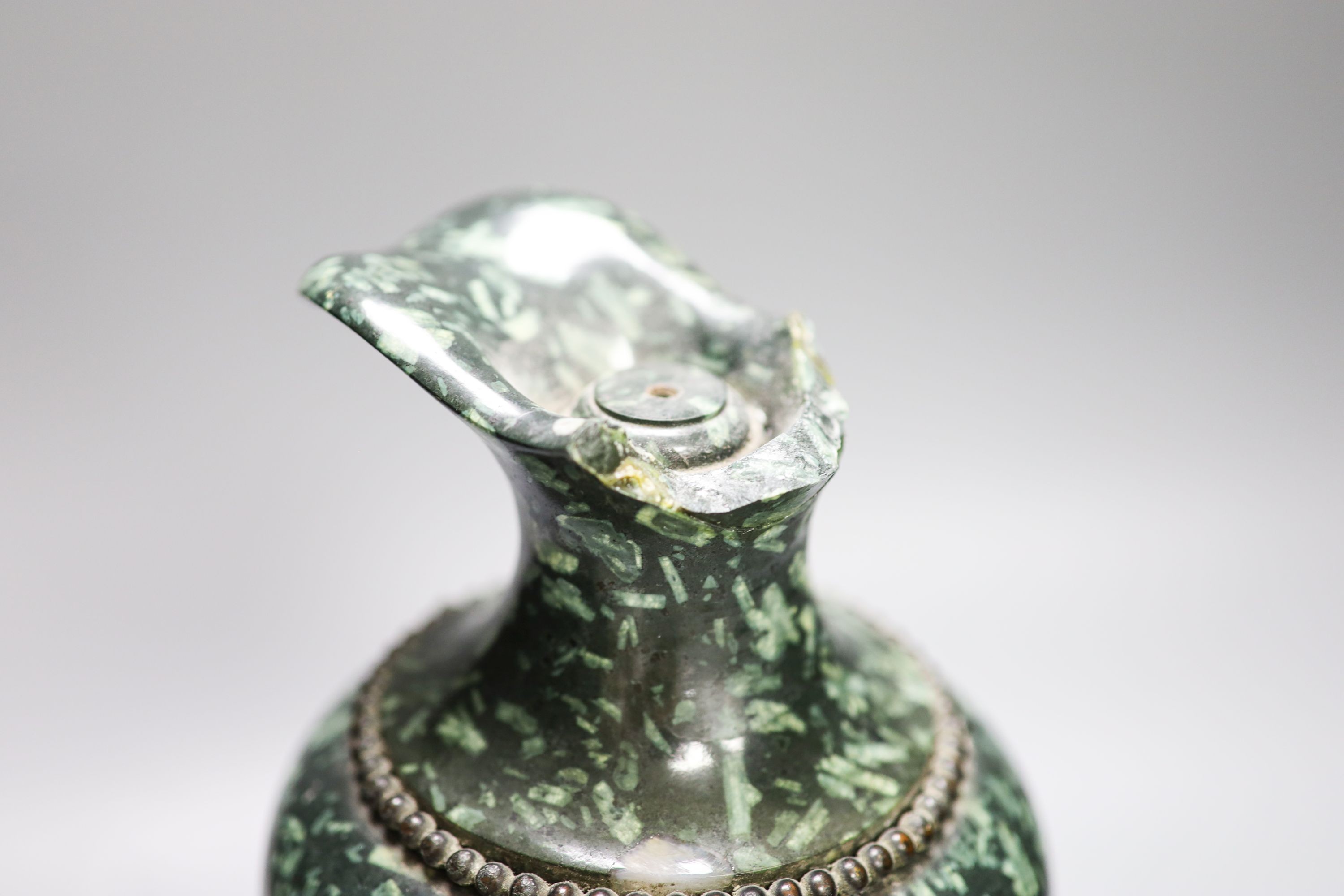 An ormolu mounted green fossil marble ewer, (a.f.) 29cm